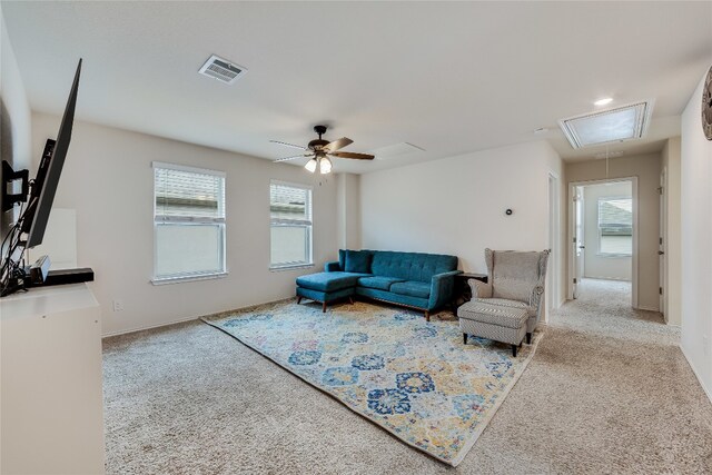 living room with carpet floors and ceiling fan