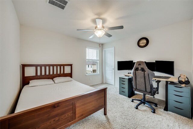 bedroom with light carpet and ceiling fan