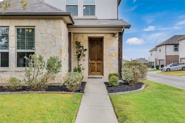 entrance to property with a yard