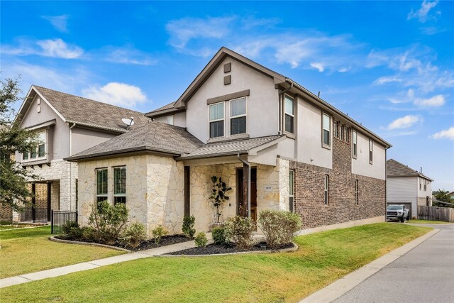 view of front of home with a front lawn