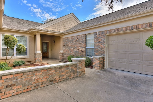 doorway to property featuring a garage