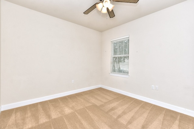 empty room with carpet flooring and ceiling fan