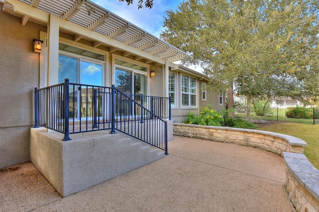 property entrance with a patio area