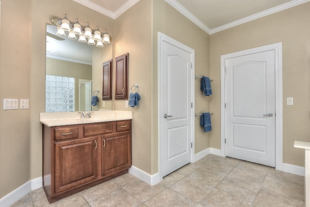 bathroom featuring ornamental molding, vanity, and tile patterned floors