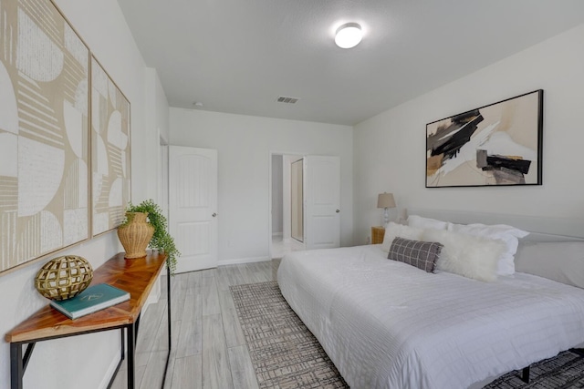 bedroom with light hardwood / wood-style flooring