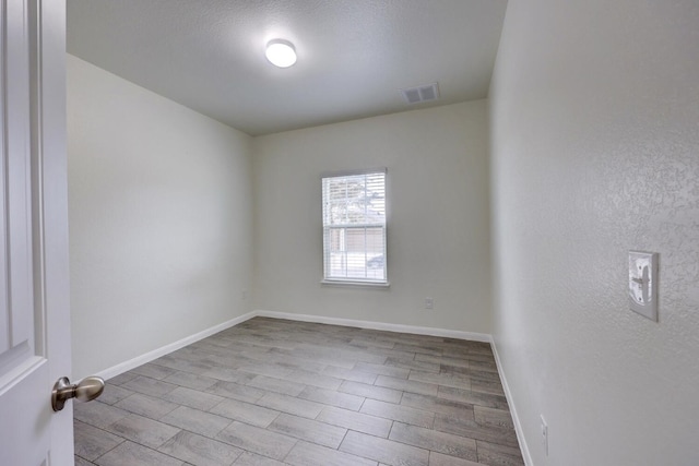 unfurnished room featuring light hardwood / wood-style flooring