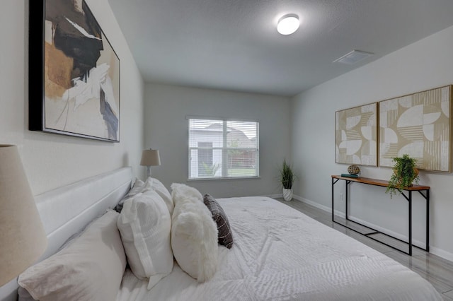 bedroom featuring light wood-type flooring