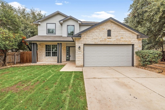 view of front of property with a front yard and a garage