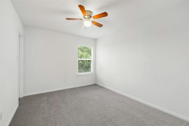 empty room featuring carpet and ceiling fan