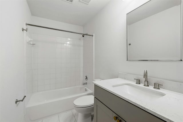 full bathroom with vanity, tiled shower / bath combo, and toilet