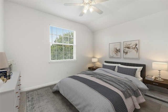 carpeted bedroom with ceiling fan and lofted ceiling