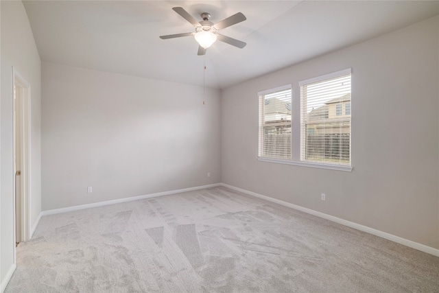 unfurnished room with light carpet and ceiling fan