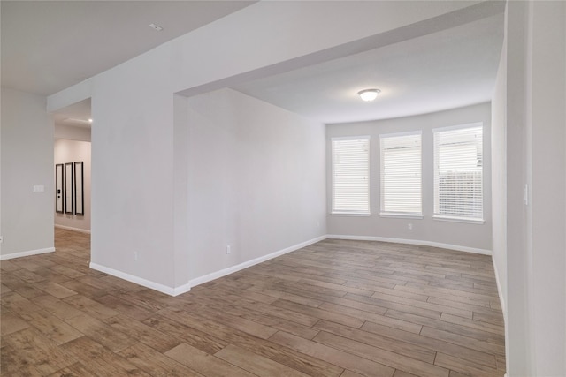 spare room featuring light hardwood / wood-style flooring