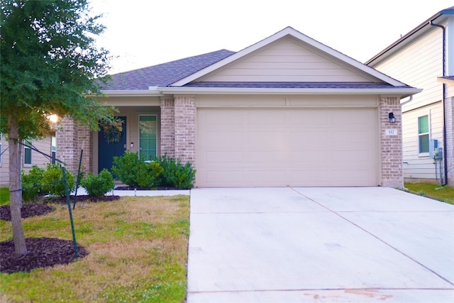 ranch-style home featuring a garage