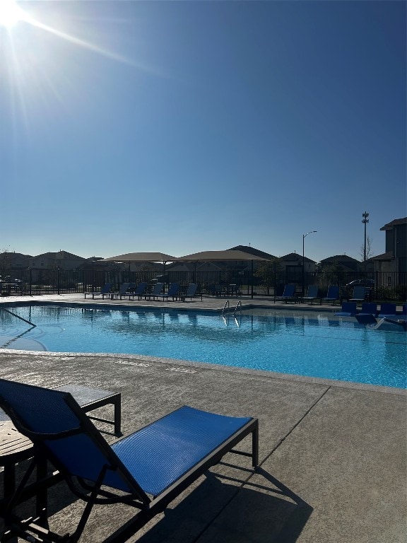 view of swimming pool featuring a patio area