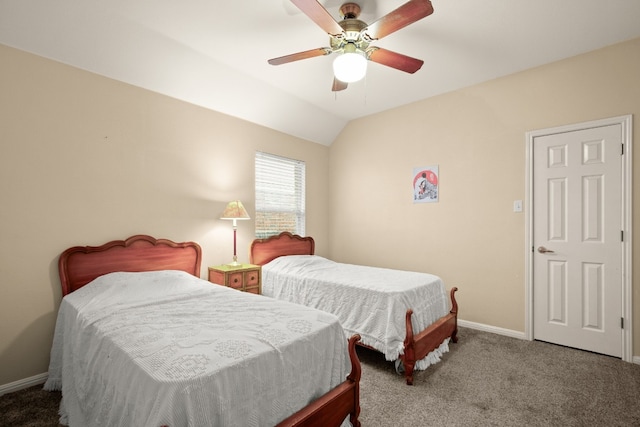 bedroom with vaulted ceiling, ceiling fan, and carpet floors