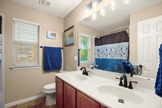 bathroom with toilet, vanity, a shower with shower curtain, and tile patterned flooring