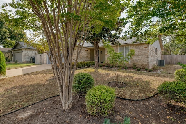 single story home featuring central air condition unit