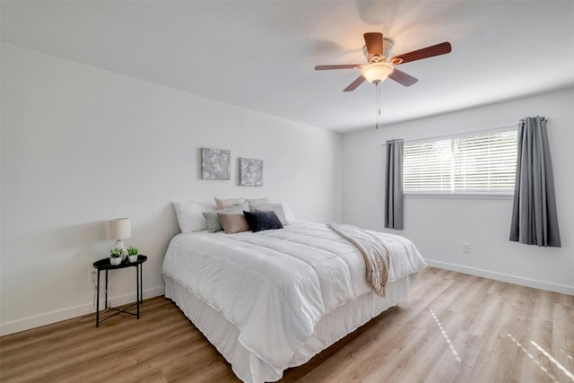 bedroom featuring ceiling fan and light hardwood / wood-style flooring