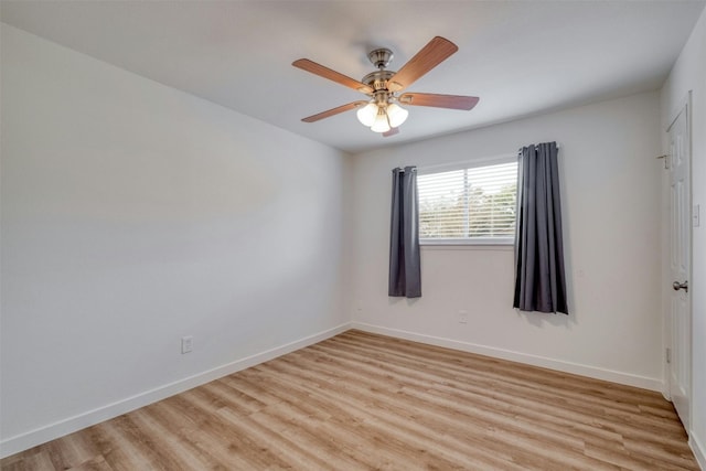 empty room featuring ceiling fan and light wood-type flooring