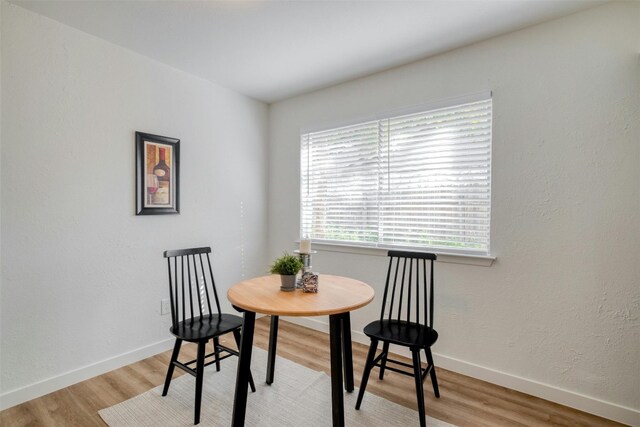 dining space featuring light wood-type flooring