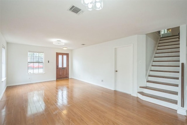 910 Crieff Cross Dr, Pflugerville, TX 78660 - foyer featuring stairs, light wood finished floors, and baseboards