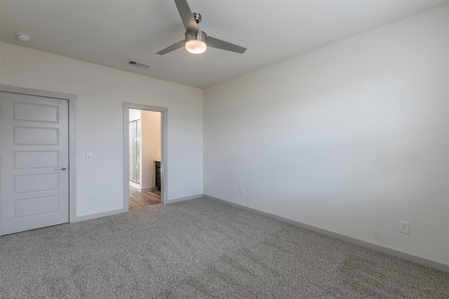 unfurnished bedroom featuring ceiling fan, a closet, and light colored carpet