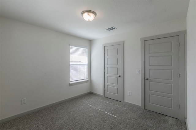 unfurnished bedroom featuring carpet floors