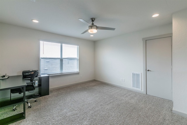 carpeted home office with ceiling fan