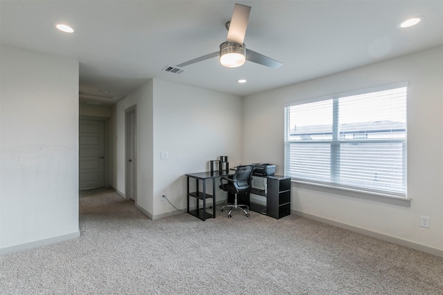 home office featuring carpet and ceiling fan