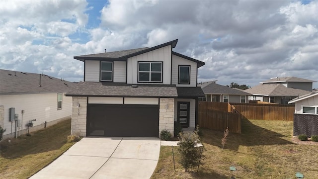 view of front of property with a front lawn and a garage