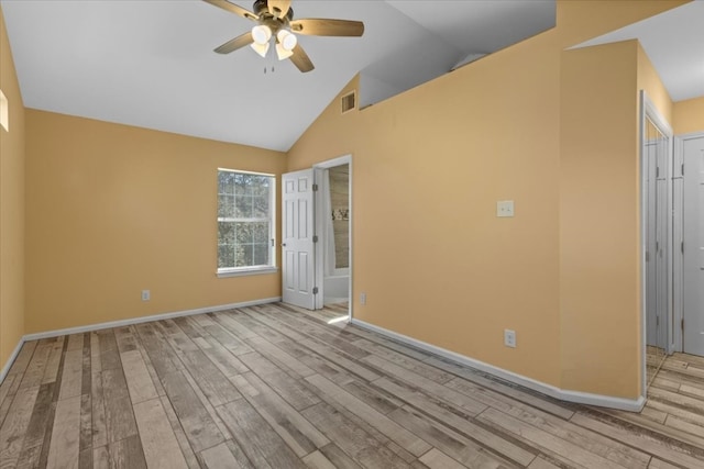 unfurnished room with light wood-type flooring, lofted ceiling, and ceiling fan