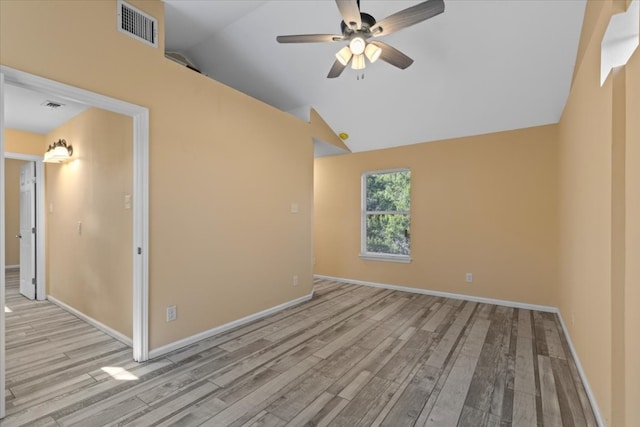 unfurnished room with light hardwood / wood-style floors, ceiling fan, and vaulted ceiling