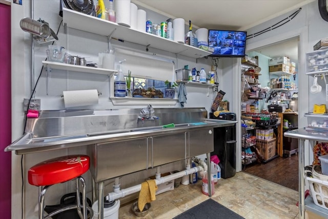 kitchen featuring hardwood / wood-style flooring and stainless steel counters