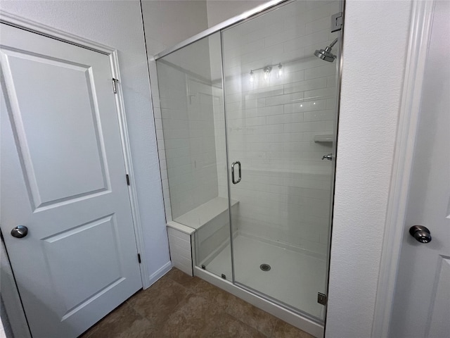 bathroom featuring an enclosed shower