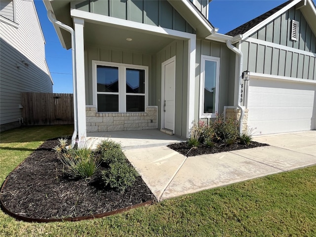 property entrance with a lawn