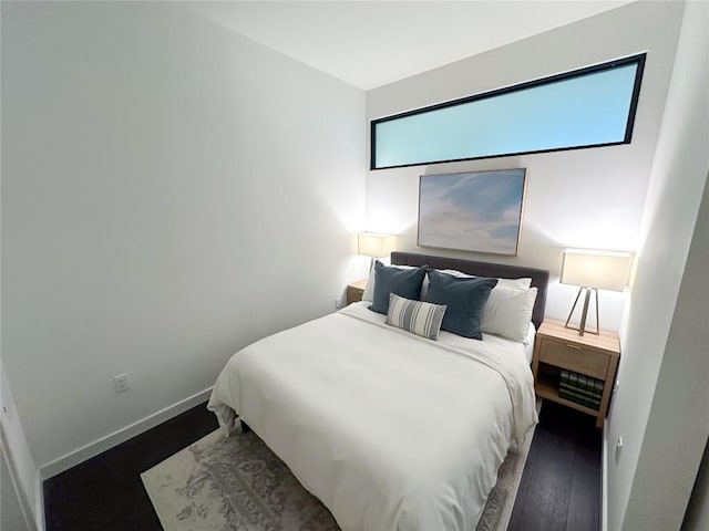 800 Embassy Dr Unit 530, Austin, TX 78702 - bedroom featuring wood finished floors and baseboards