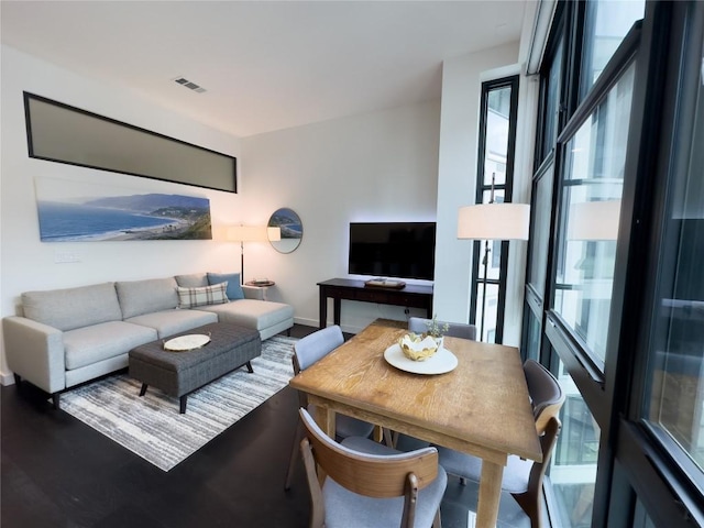 800 Embassy Dr Unit 530, Austin, TX 78702 - living area with healthy amount of natural light, baseboards, and wood finished floors