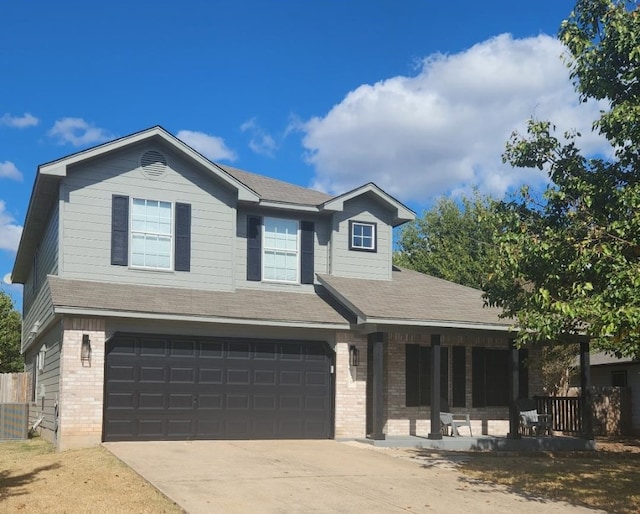 view of front of house with a garage and a porch