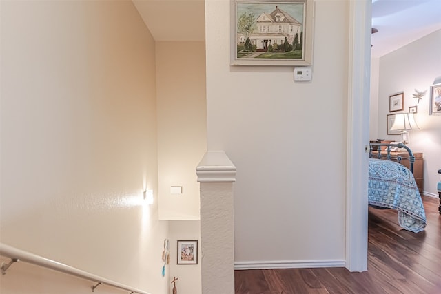 corridor with dark hardwood / wood-style floors