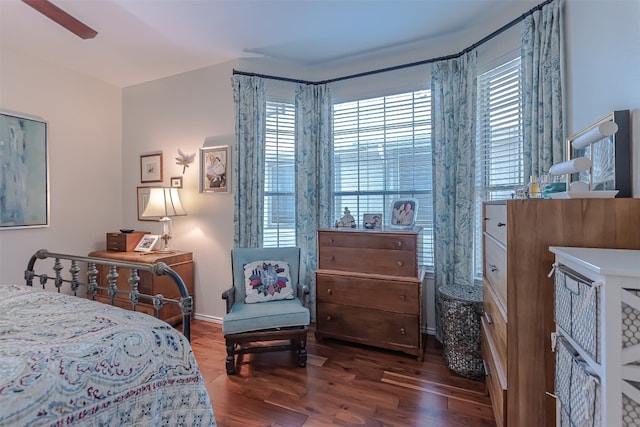 bedroom with ceiling fan and dark hardwood / wood-style floors