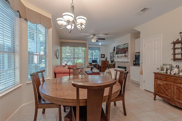 2000 Cullen Ave Unit 9, Austin, TX 78757 - dining space featuring light tile patterned floors, a chandelier, healthy amount of natural light, and ceiling fan
