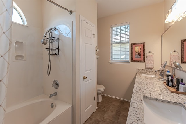 full bathroom featuring vanity, bathing tub / shower combination, and toilet