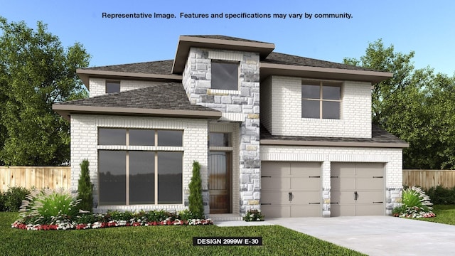 view of front of house featuring a garage and a front yard