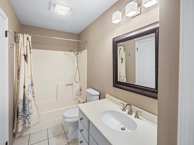 full bathroom with tile patterned flooring, vanity, shower / bath combo with shower curtain, and toilet