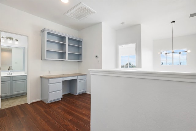 unfurnished office with dark wood-type flooring