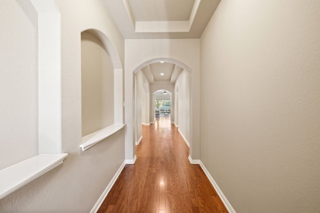 hall with hardwood / wood-style floors