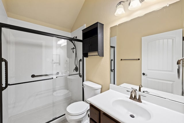 bathroom featuring walk in shower, vanity, toilet, and vaulted ceiling