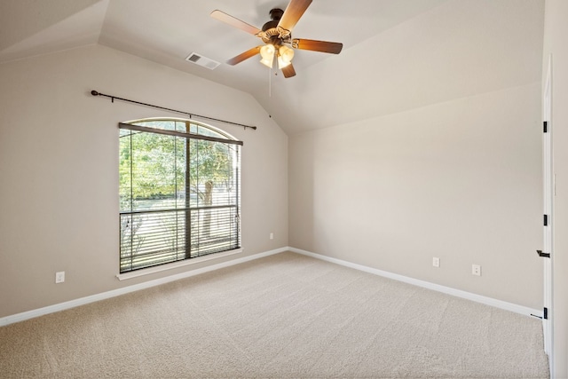 carpeted spare room with lofted ceiling and ceiling fan