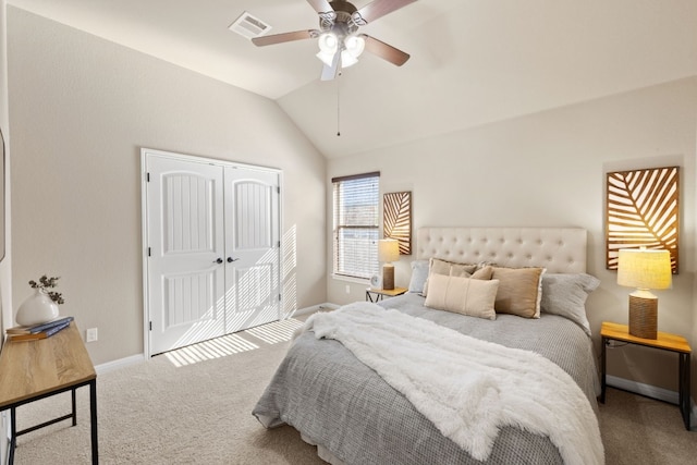 carpeted bedroom with lofted ceiling, ceiling fan, and a closet